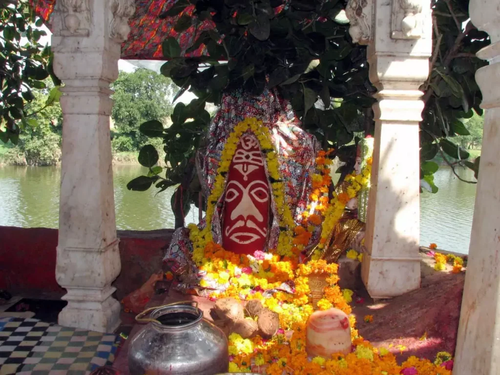 Holy Siddhvat Banyan Tree in Ujjain with pilgrims tying threads